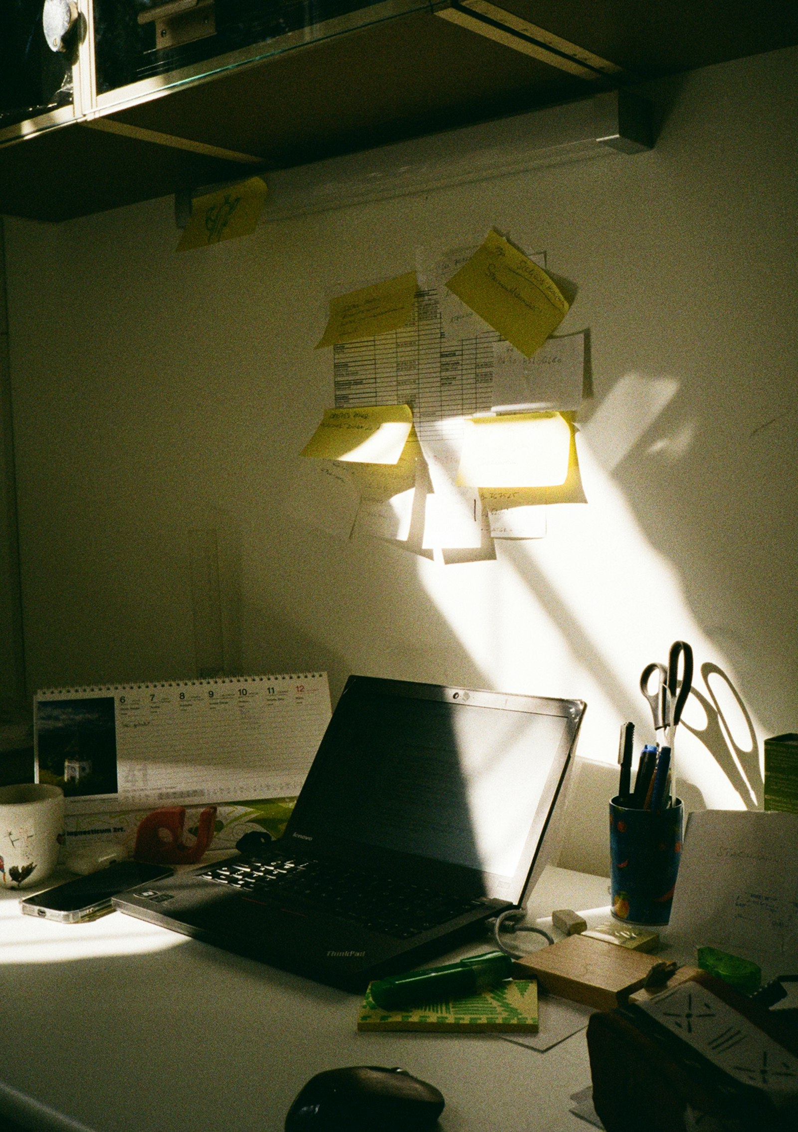 Sunlit desk with laptop and notes for planning therapist SEO and AI search updates